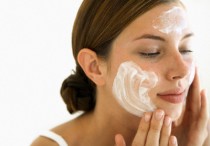 Young Woman Using Facial Cream